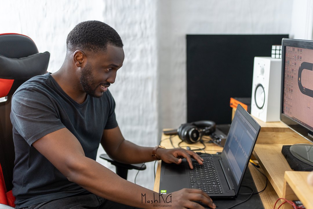 Adrian Silas working in his home music production studio