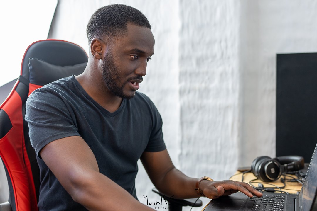 Adrian working on music at his studio desk