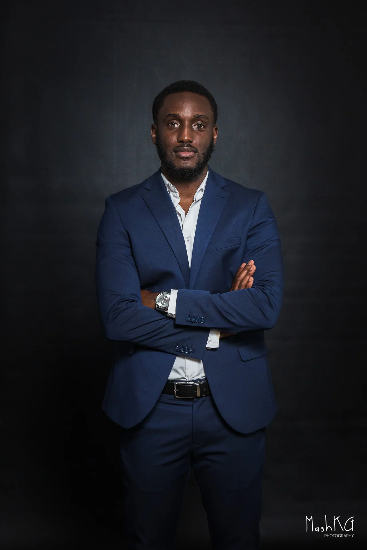 Adrian Silas, on-camera presenter, in a navy suit