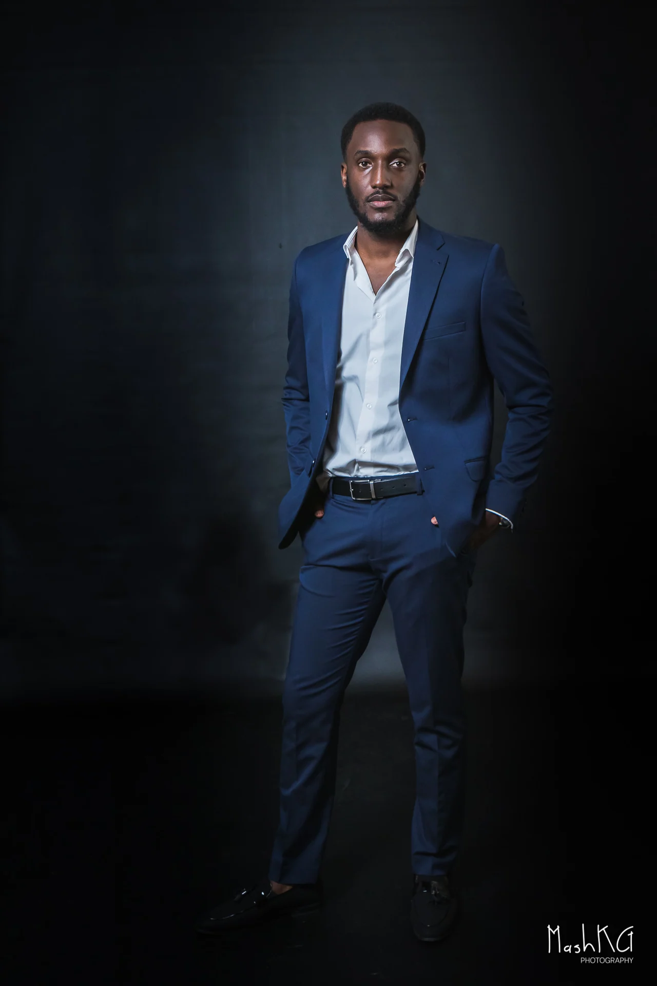 Adrian Silas, creative producer and presenter in a navy suit
